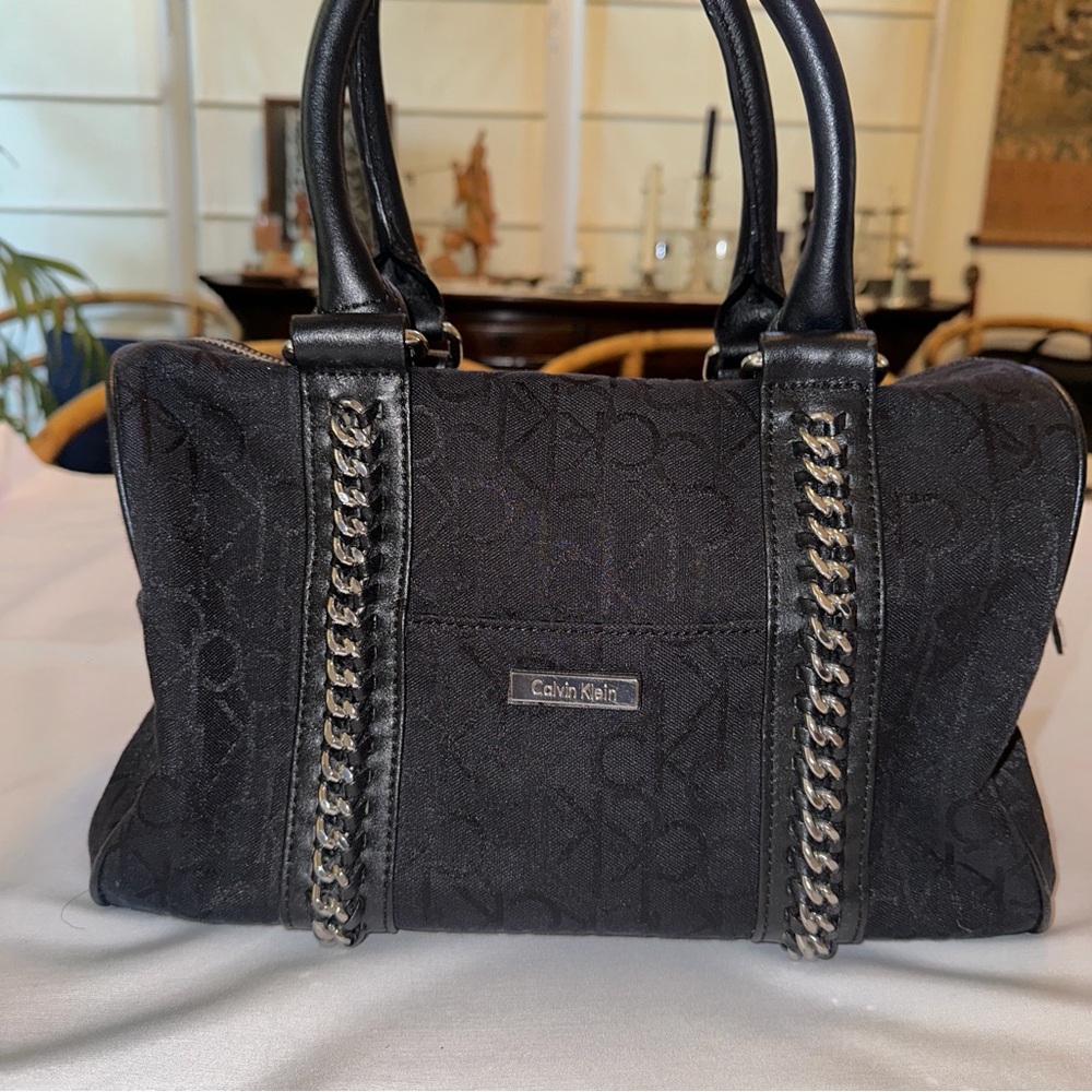 Calvin Klein black monogram satchel with silver-tone chain details.